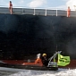 Greenpeace Activists Climb Aboard Coal Ship