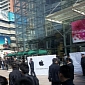Guards Take Down Apple Store Banners in Dalian, China