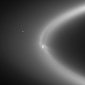 How Enceladus Interacts with Saturn's E Ring