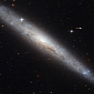 Hubble Zooms In on Dusty Spiral Galaxy