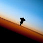 ISS Crew Captures Silhouette Photo of Endeavor
