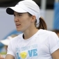 Justine Henin Starts a New Career: Tennis NPC in Online Game