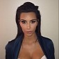Kim Kardashian Flashes Cleavage in New Passport Photo, Is the Image of Class