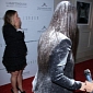 Kim Kardashian Gets Flour-Bombed on the Red Carpet