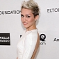 Miley Cyrus Parties with Mystery Man, Not Wearing Engagement Ring