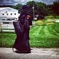 Mysterious Woman Completely Dressed in Black Seen Walking Across the US