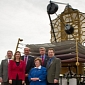 Officials Pose with Full-Scale JWST Model