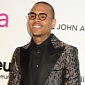 Oscars 2013: Chris Brown Flirts with the Ladies at Vanity Fair Party