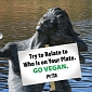 PETA Supporter Bares All, Lies on a Giant Plate in London