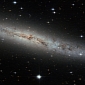 Pancake Galaxy Shines Bright in Hubble's Eyes