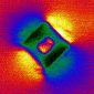Particles Learn to Self-Assemble in Liquid Crystal