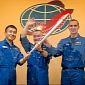 Photo: Expedition 38 Crew Poses with the Olympic Torch