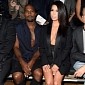Photo of the Day: Kim Kardashian, Kanye West Have Cleavage-Off at Paris Fashion Week