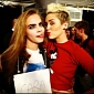 Photo of the Day: Miley Cyrus Gives Supermodel Cara Delevingne Some Tongue