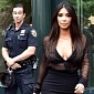 Photo of the Day: New York Cop Isn’t Impressed with Kim Kardashian’s Derriere