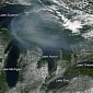 Photo of the Day: Smoke Pictured Hovering over the Great Lakes