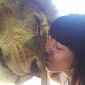 Picture of the Day: Woman Rubs Noses with a Lion