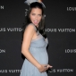 Pregnant Adriana Lima Stays Fit with Yoga