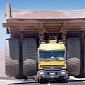 Regular Trailer Transports Huge Mining Truck, Looks like a Toy
