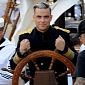 Robbie Williams Is Dashing Ship Captain in “Go Gentle” Music Video
