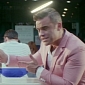 Robbie Williams Is Very Problematic Angel in “Candy” Video