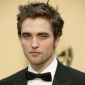 Robert Pattinson Auctions Kisses for amfAR in Cannes