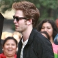 Robert Pattinson Hit by Moving Taxi as He Flees from Fans
