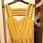 Seller Appears Naked in eBay Yellow Skater Dress Post, Drives Price Up