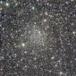 Star Cluster Detected Beyond a Curtain of Dust and Fog