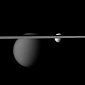 View of Tethys, Titan Obscured by Saturn's Rings