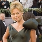 Woman Pays $140,000 to Kiss Charlize Theron