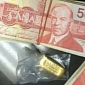 Woman Wins Clock Radio, Finds a Lot of Cash and a Gold Bar in Box