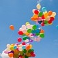 Dozens of Helium Balloons Fly Man High Up Over the Clouds