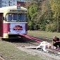Russian Woman Drags 17-Ton Tram Car - Video