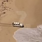 Suspect Drives His Car into the Ocean to Escape the Police - Video