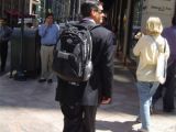Suits with backpacks, a fatal combination