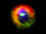 The image "seen" by ALMA, dust in the outer cloud is red, dense gas is green, diffuse gas in the central gap is blue. The filaments are visible (barely) at the three o'clock and ten o'clock positions