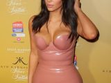 Kim Kardashian promotes new fragrance in Australia, at the same time as Jolie pushes “Unbroken”
