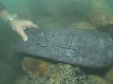 Photo shows the silver bar found by Barry Clifford and fellow explorers