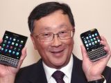 John Chen showing the BlackBerry Passport (left) and Classic (right)