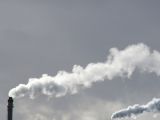 Carbon emissions, as seen over the smokestacks of a power plant