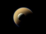 Titan and Rhea (foreground), both Saturn's moons