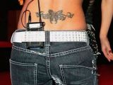 How it once was: Cheryl Cole’s lower back tattoo of a butterfly and some barbed wire