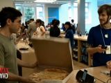 Mark eats a pizza at the Soho Apple store