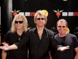 Bon Jovi rockers say they make so much money because they don't spend like celebrities while on the road