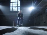 Eminem raps in “Guts over Fear” music video