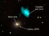Image shows galaxy J0836 and the gas reserves expelled from it by a massive black hole