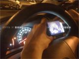 The device owner is taking a snap of the car's dashboard to show off the new auto-focus capabilities