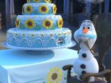 Olaf the snowman can't help himself around Anna's birthday cake