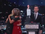 Jimmy Kimmel shows Aniston’s prize (a bar of soap on a string) but she’s more interested in hugging Lisa Kudrow